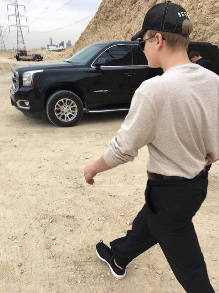 Scott's son, Devon, helping the family business as they tour in Saudi Arabia.